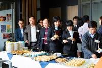 Guests and students joining tea reception at Lanson Terrace